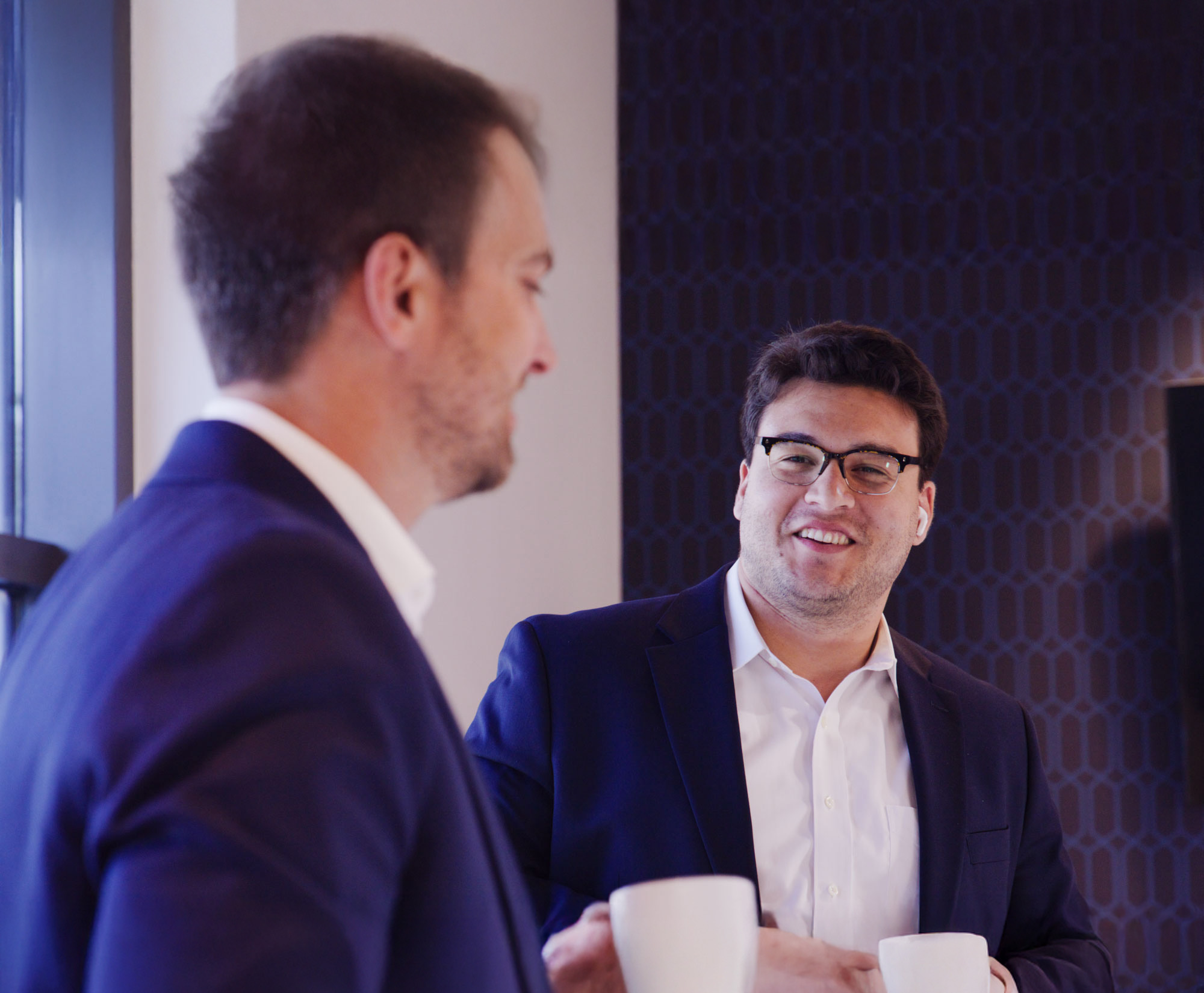 Two experts discussing mergers and acquisitions at Walden M&A